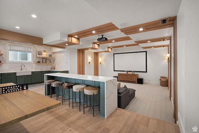 1565 N Overolook Ct, Farmington, UT 84025 - cinema with a sink, light wood finished floors, recessed lighting, and baseboards