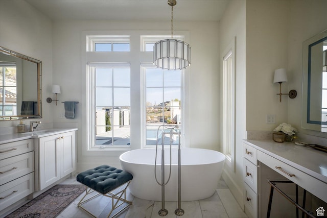 1565 N Overolook Ct, Farmington, UT 84025 - bathroom featuring healthy amount of natural light, vanity, and a freestanding bath