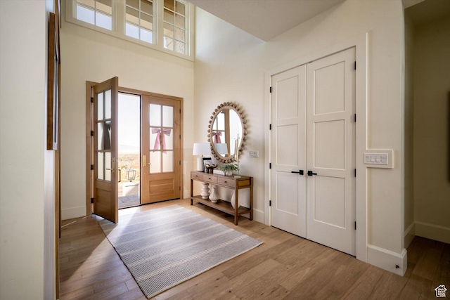1565 N Overolook Ct, Farmington, UT 84025 - foyer with wood finished floors, plenty of natural light, and a high ceiling