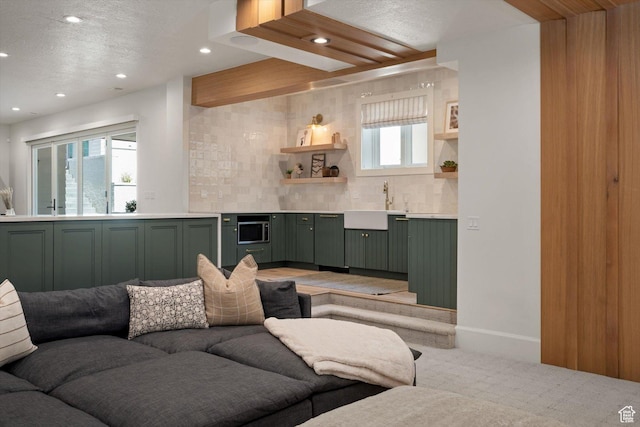 1565 N Overolook Ct, Farmington, UT 84025 - living area with recessed lighting, light carpet, wet bar, a textured ceiling, and baseboards