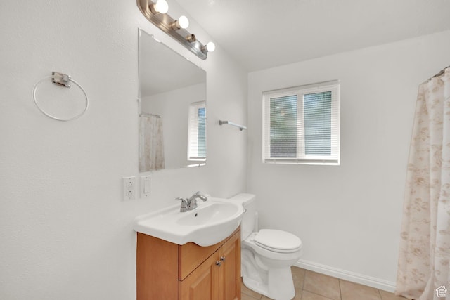 4242 S 6530 W, West Valley City, UT 84128 - full bath featuring tile patterned flooring, vanity, toilet, and baseboards