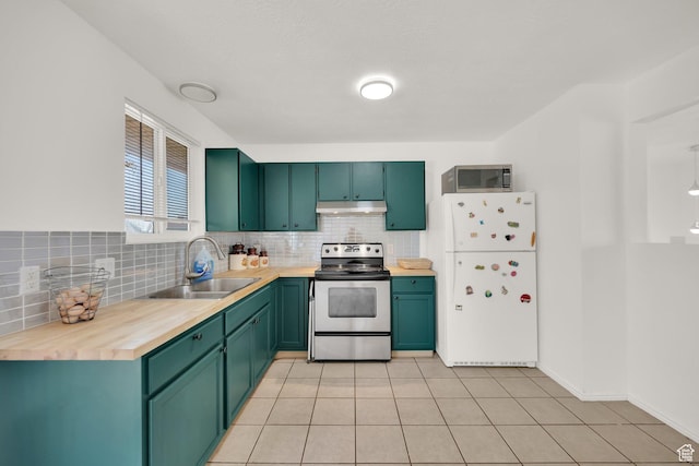 4242 S 6530 W, West Valley City, UT 84128 - kitchen with appliances with stainless steel finishes, a sink, under cabinet range hood, and tasteful backsplash