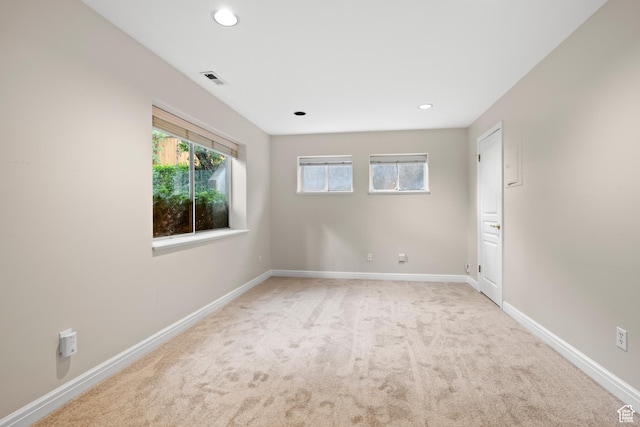 carpeted spare room with baseboards and recessed lighting