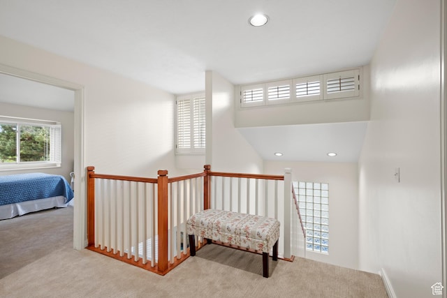 hall with carpet flooring and recessed lighting
