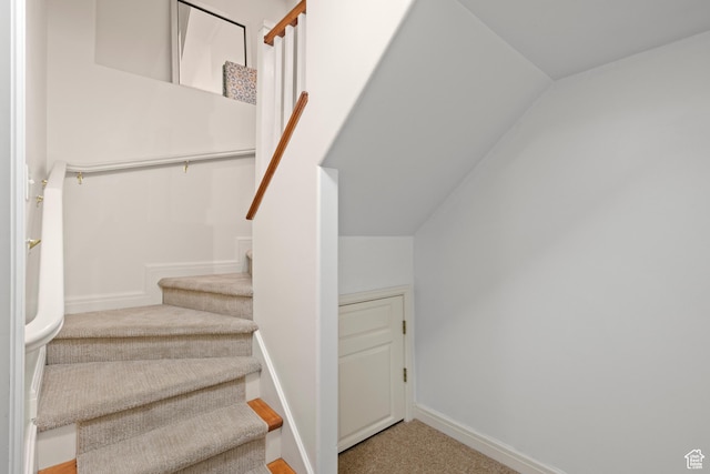 stairway with carpet flooring and baseboards