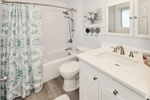 bathroom with wood finished floors, toilet, shower / tub combo with curtain, and vanity