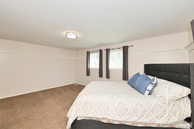 carpeted bedroom with baseboards