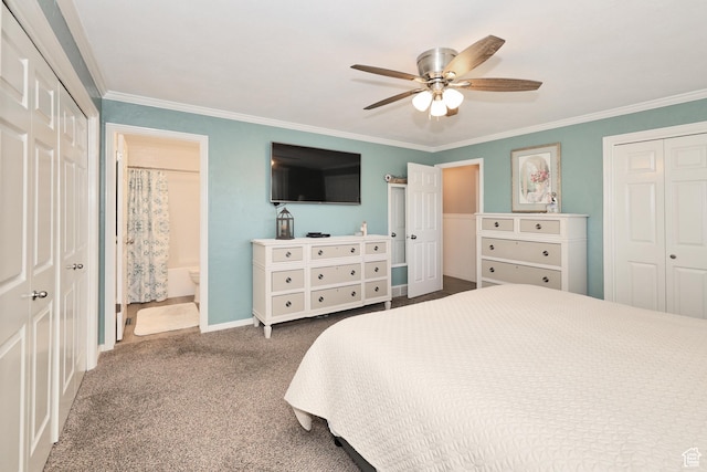 bedroom featuring carpet flooring, ornamental molding, ensuite bath, ceiling fan, and baseboards