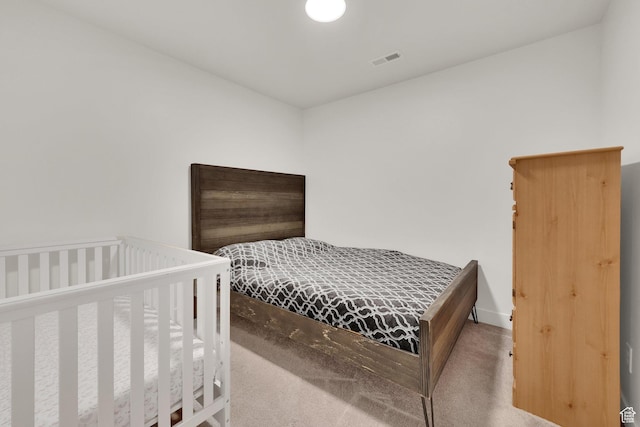 bedroom with carpet and baseboards