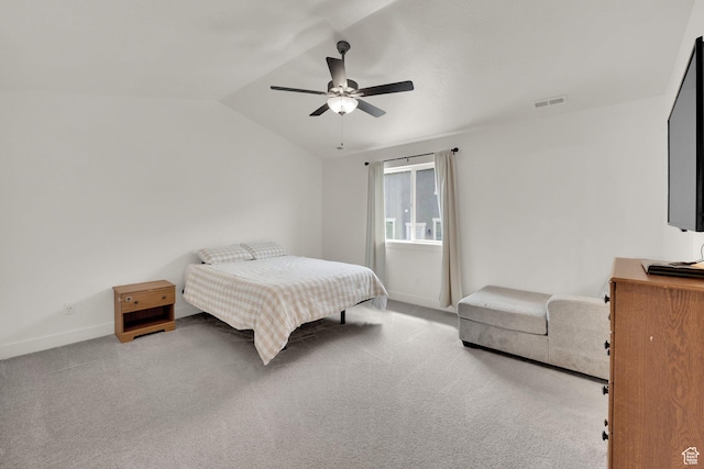 bedroom with baseboards, lofted ceiling, carpet flooring, and ceiling fan
