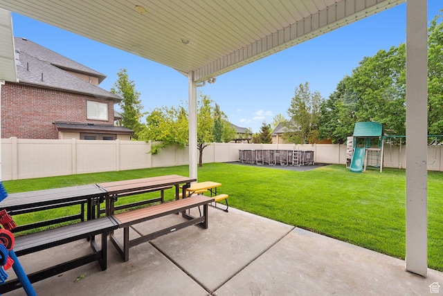 view of patio with outdoor dining space and a playground