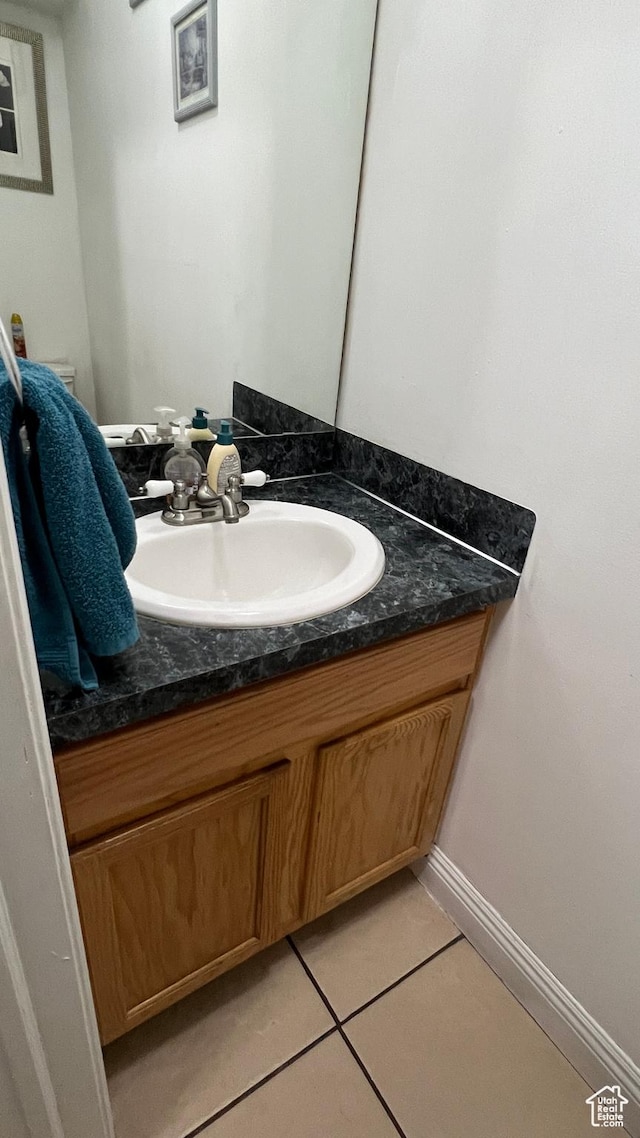 2788 Gettysburg Way, Ogden, UT 84401 - half bathroom featuring vanity, tile patterned floors, and baseboards