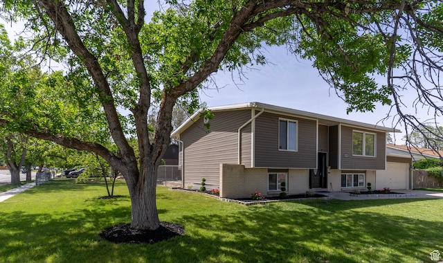 4740 S 3040 W, Taylorsville, UT 84129 - view of front of house with a garage and brick siding