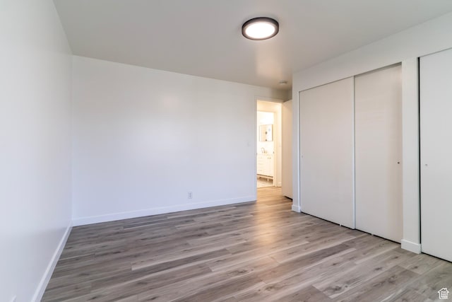 4740 S 3040 W, Taylorsville, UT 84129 - unfurnished bedroom with light wood-style flooring and baseboards