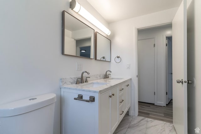 4740 S 3040 W, Taylorsville, UT 84129 - bathroom with marble finish flooring, double vanity, and toilet