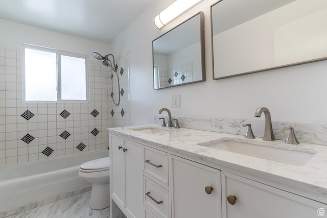 4740 S 3040 W, Taylorsville, UT 84129 - bathroom featuring toilet, double vanity, marble look tiles, and shower / bathtub combination
