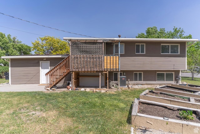 4740 S 3040 W, Taylorsville, UT 84129 - back of house with a vegetable garden, stairs, a deck, and cooling unit