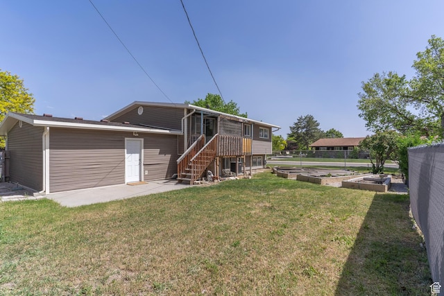4740 S 3040 W, Taylorsville, UT 84129 - rear view of house with a vegetable garden and stairs