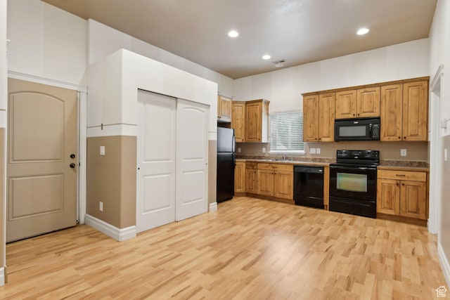 1737 S Kerrybrook Dr, Kaysville, UT 84037 - kitchen with black appliances, light wood finished floors, recessed lighting, a sink, and brown cabinets
