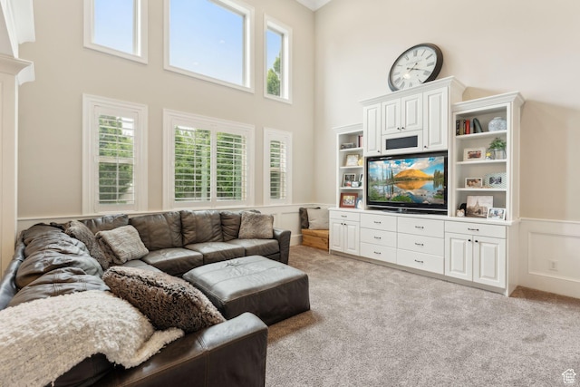 1737 S Kerrybrook Dr, Kaysville, UT 84037 - living room with a wainscoted wall, a towering ceiling, plenty of natural light, light carpet, and a decorative wall