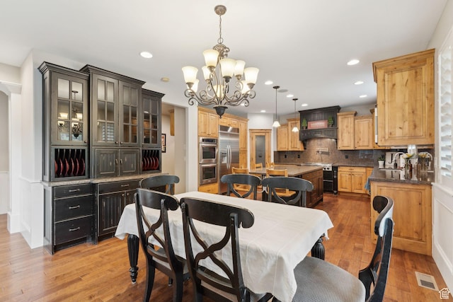 1737 S Kerrybrook Dr, Kaysville, UT 84037 - dining area with a chandelier, wood finished floors, and recessed lighting