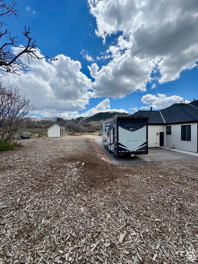 9351 E Acorn Cir Unit 921, Heber City, UT 84032 - view of yard with a storage unit and a patio area