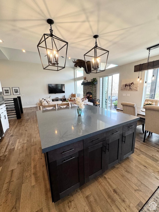 9351 E Acorn Cir Unit 921, Heber City, UT 84032 - kitchen featuring open floor plan, hardwood / wood-style flooring, a chandelier, and healthy amount of natural light