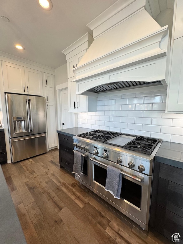 9351 E Acorn Cir Unit 921, Heber City, UT 84032 - kitchen with high quality appliances, premium range hood, dark wood-type flooring, white cabinets, and recessed lighting