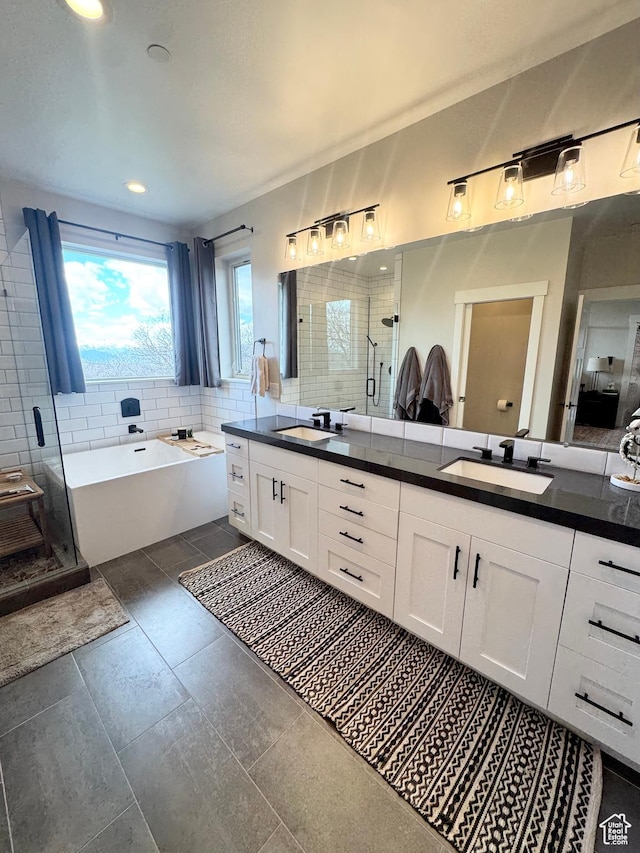 9351 E Acorn Cir Unit 921, Heber City, UT 84032 - full bathroom with double vanity, a garden tub, a shower stall, tasteful backsplash, and recessed lighting