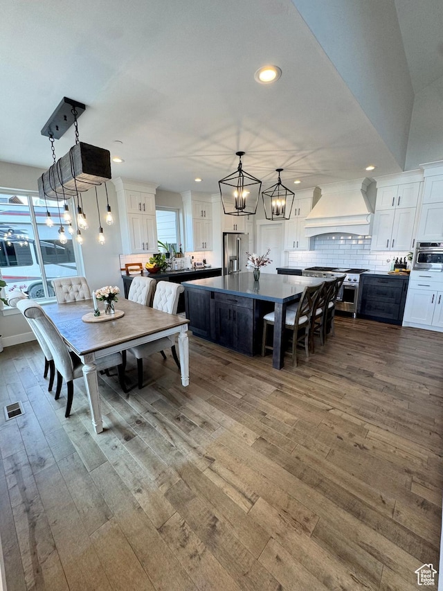 9351 E Acorn Cir Unit 921, Heber City, UT 84032 - dining space with a chandelier, wood finished floors, and recessed lighting