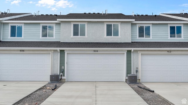 104 N Seaside St Unit 2312, Saratoga Springs, UT 84045 - garage featuring concrete driveway and central air condition unit