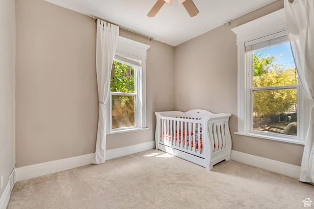 215 E 2nd Ave S, Salt Lake City, UT 84103 - bedroom featuring carpet flooring, baseboards, a crib, and ceiling fan