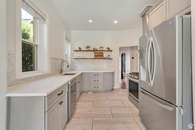 215 E 2nd Ave S, Salt Lake City, UT 84103 - kitchen with stainless steel appliances, open shelves, a sink, gray cabinetry, and recessed lighting