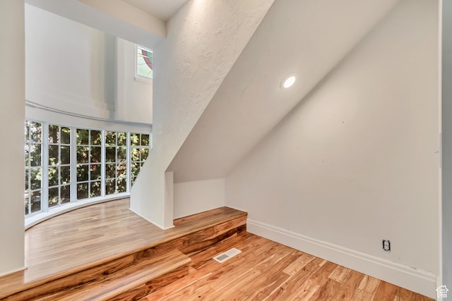 215 E 2nd Ave S, Salt Lake City, UT 84103 - additional living space featuring wood finished floors, baseboards, and recessed lighting