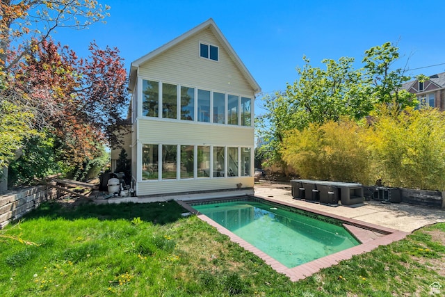 215 E 2nd Ave S, Salt Lake City, UT 84103 - rear view of property featuring a patio area, a sunroom, and a lawn