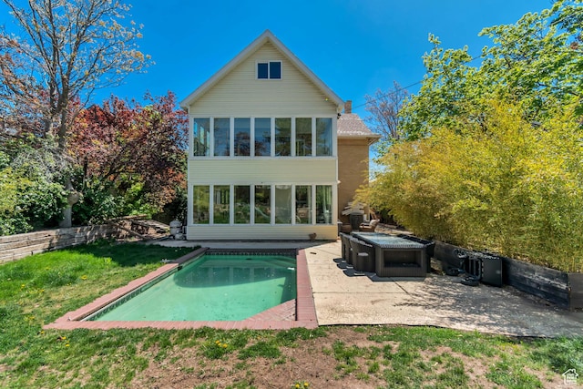 215 E 2nd Ave S, Salt Lake City, UT 84103 - back of house featuring a patio, an outdoor pool, a hot tub, and a sunroom