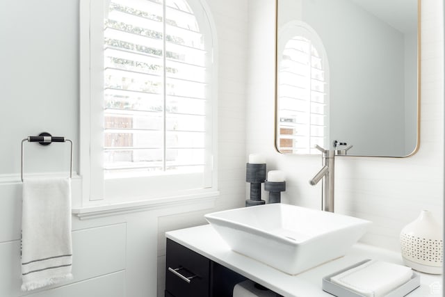 bathroom featuring plenty of natural light and vanity