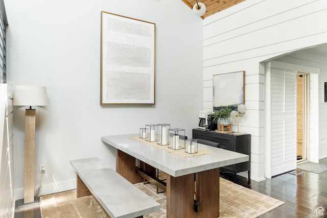 bathroom with wood finished floors, baseboards, and wood ceiling