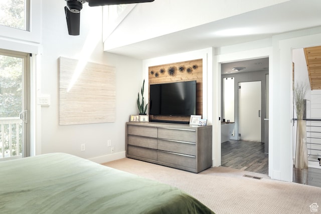 carpeted bedroom with baseboards, access to exterior, and a ceiling fan