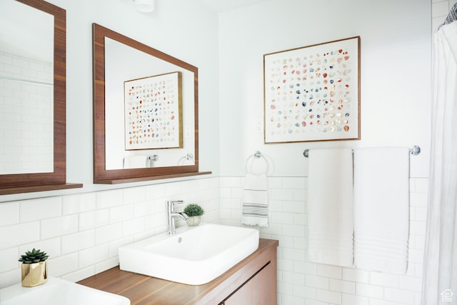 full bathroom with a sink and tasteful backsplash
