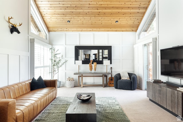 carpeted living area featuring a decorative wall, high vaulted ceiling, and wooden ceiling