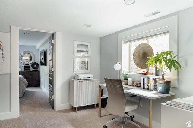 office space featuring light colored carpet, radiator, recessed lighting, and baseboards