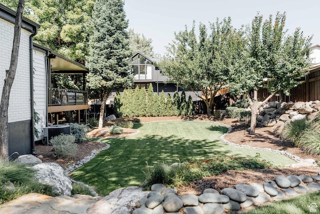 view of yard with central AC