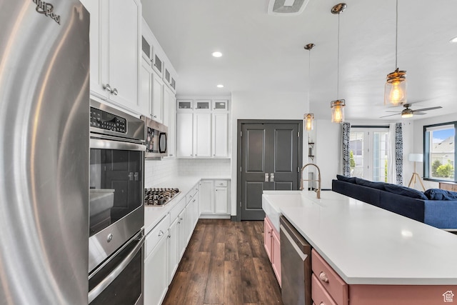 11386 S New Bern Way S, Jordan, UT 84009 - kitchen with stainless steel appliances, a sink, open floor plan, recessed lighting, and dark wood-style floors
