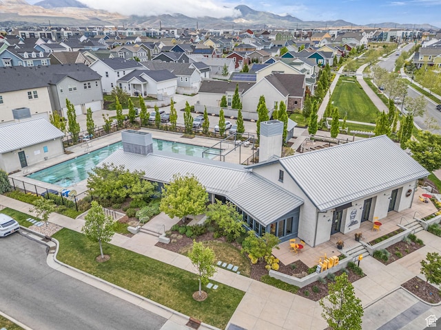 11386 S New Bern Way S, Jordan, UT 84009 - aerial perspective of suburban area with a pool and mountains