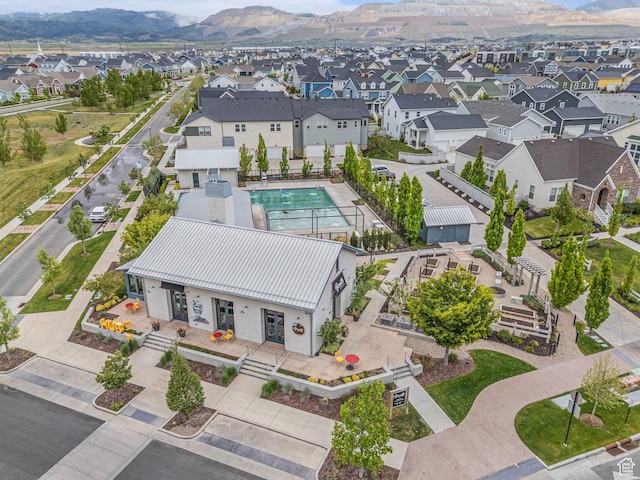 11386 S New Bern Way S, Jordan, UT 84009 - aerial view of residential area featuring a mountainous background and a pool area