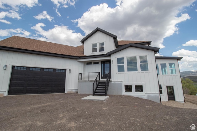 479 S 550 E, Wallsburg, UT 84082 - view of front of house with an attached garage, driveway, roof with shingles, and board and batten siding