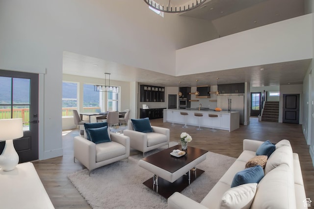 479 S 550 E, Wallsburg, UT 84082 - living room featuring a towering ceiling, light wood-style flooring, and baseboards