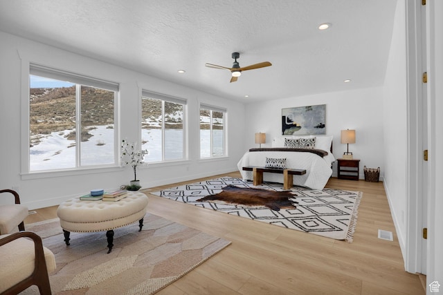 1441 N Jerry Gertsch Ln, Midway, UT 84049 - bedroom with multiple windows, wood finished floors, baseboards, ceiling fan, and recessed lighting