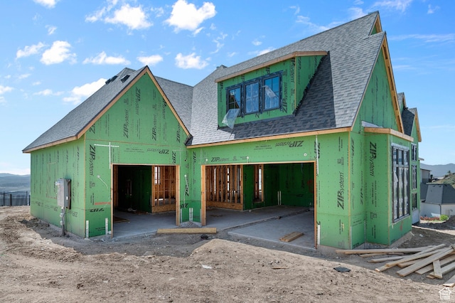 view of front of home with roof with shingles